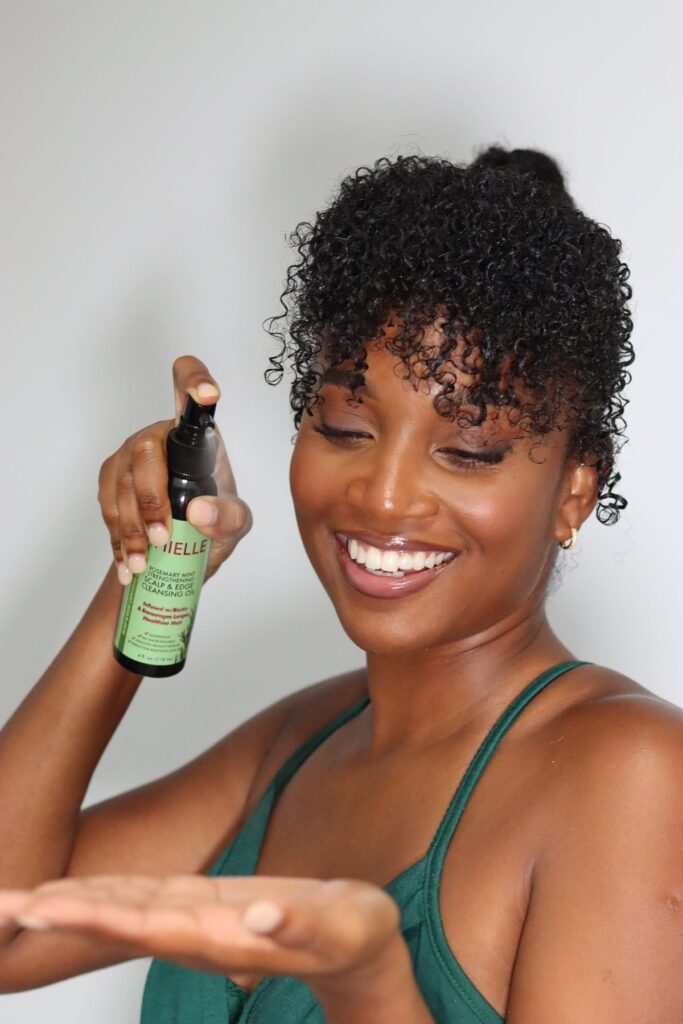 picture of someone holding scalp oil