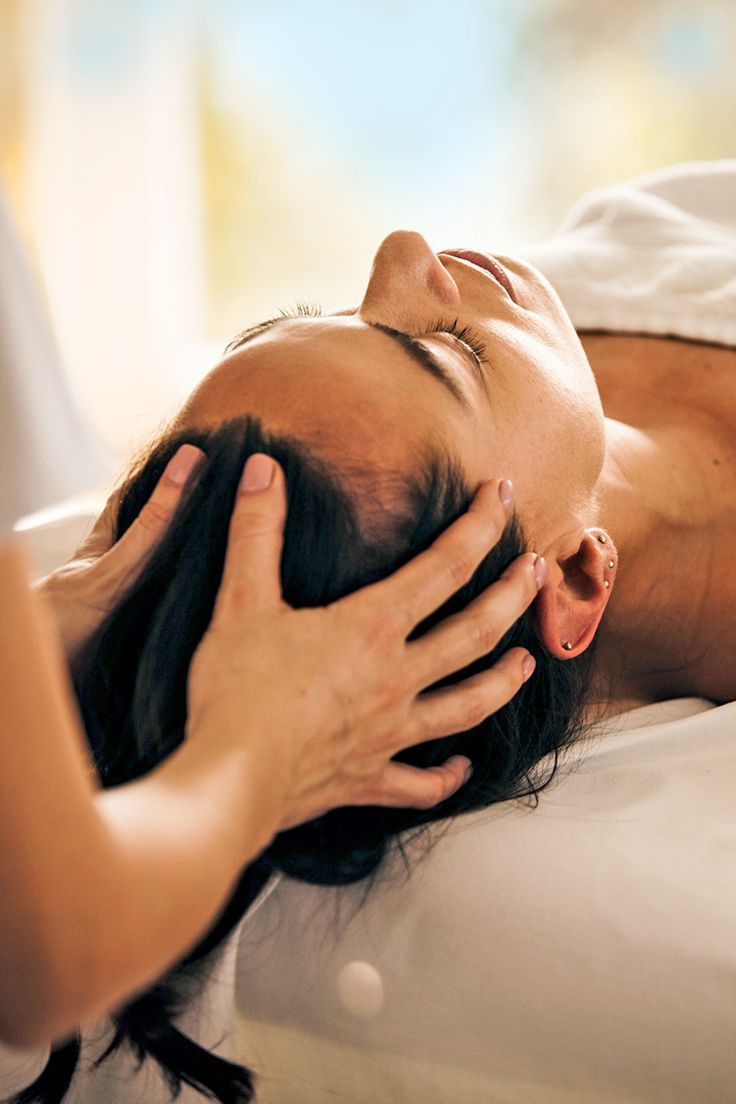 someone that is receiving a scalp massage