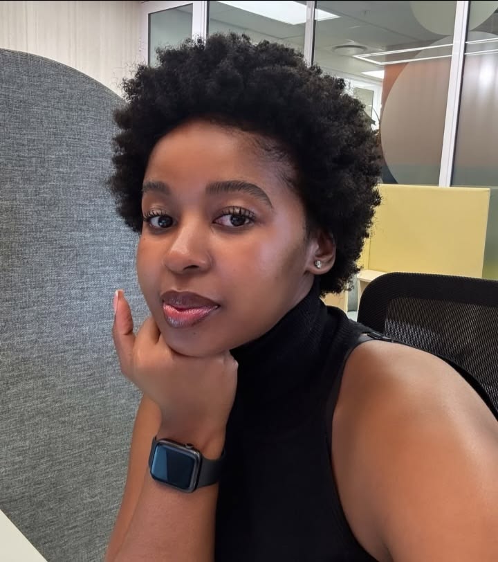 a girl with short afro