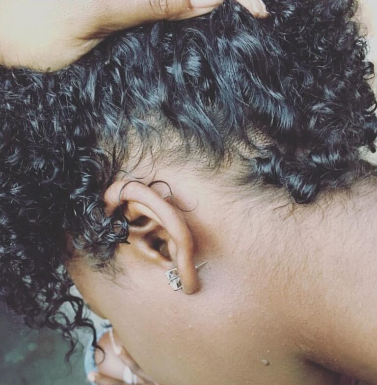someone checking her hair porosity