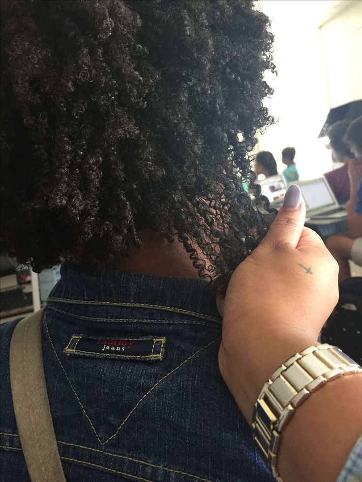someone checking her hair porosity