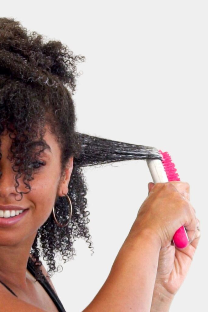 someone brushing wet hair