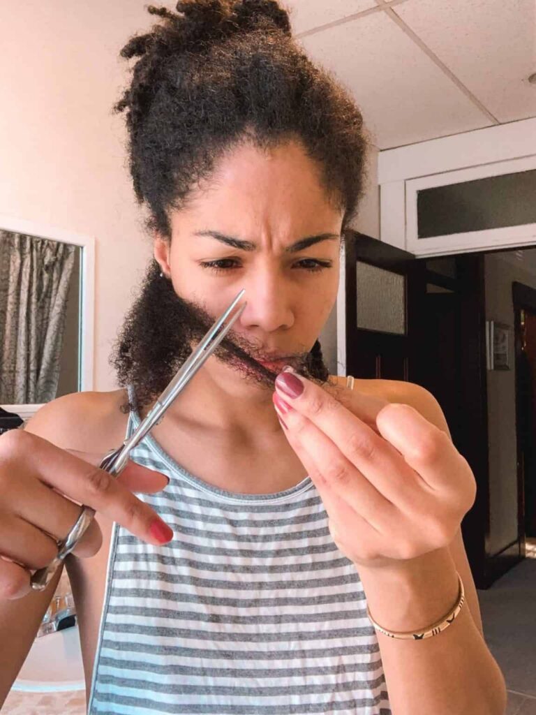 someone trimming her hair