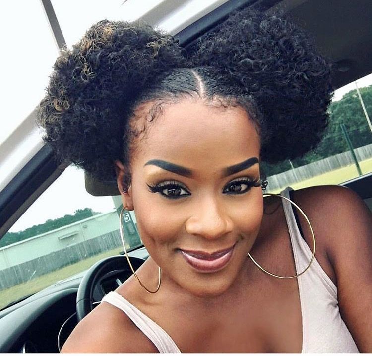 a lady with space buns simple beginners afro hairstyle