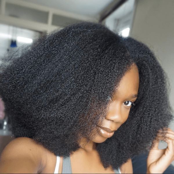 a girl with stretched afro 