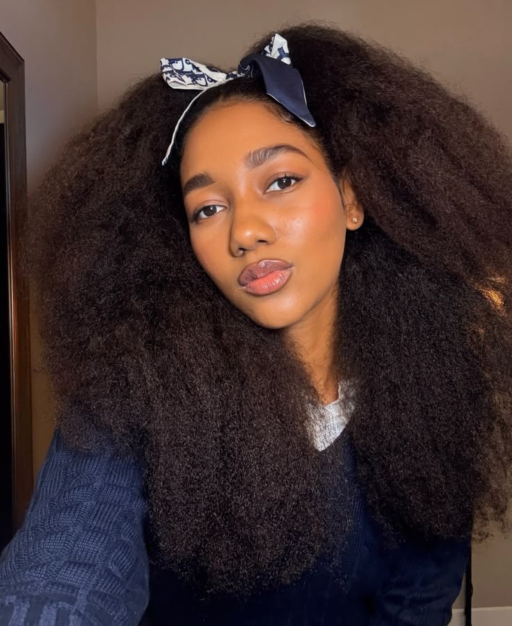 someone with full stretched afro