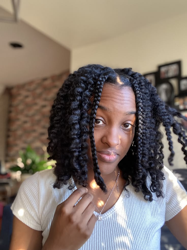 a girl taking down her braids