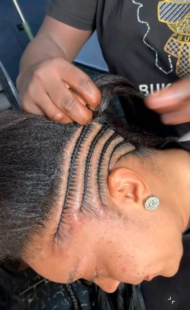someone making tight and tension hairstyle