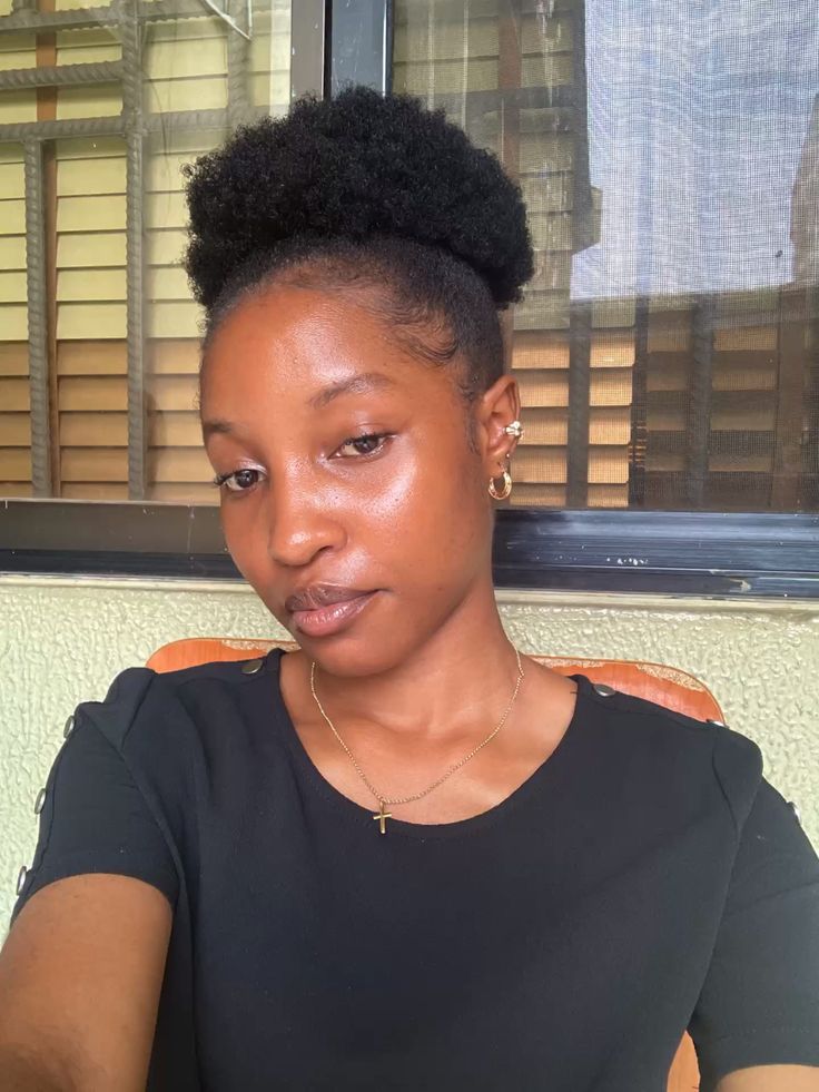 a girl with tiwa puff