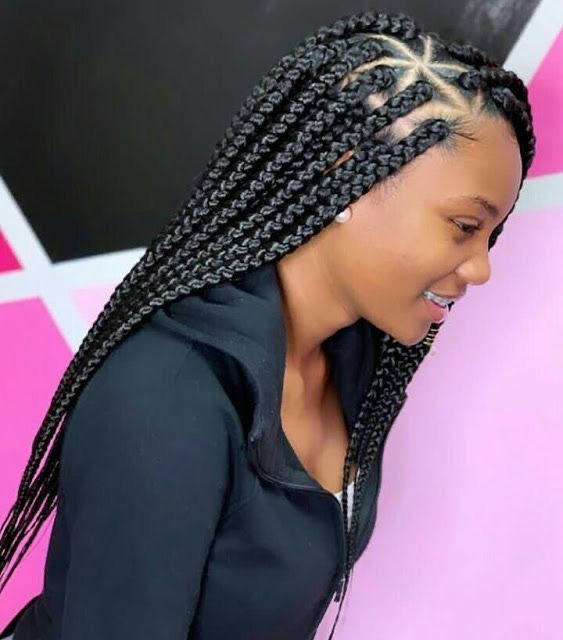 a lady with a triangle box braid beautiful hairstyle