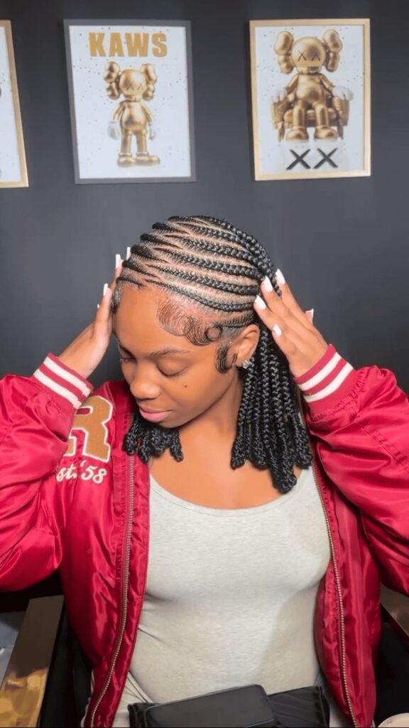 a girl with tribal braids protective styles for afro hair
