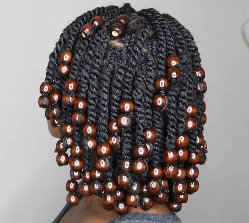 someone with beaded twist