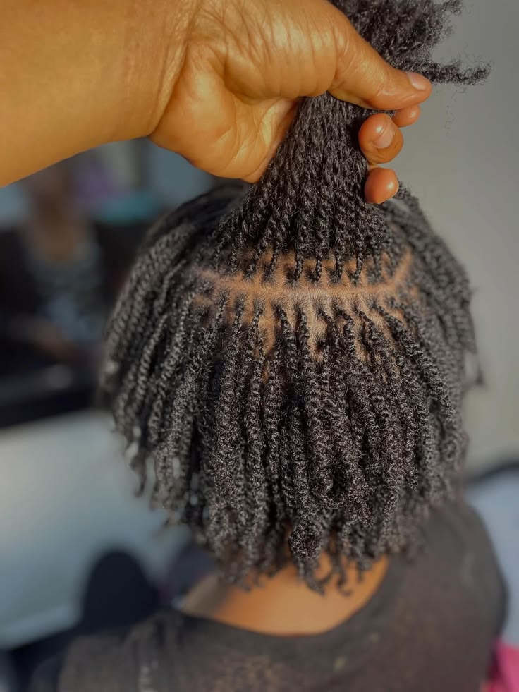 a girl with twist protective style as part of hair retention tips