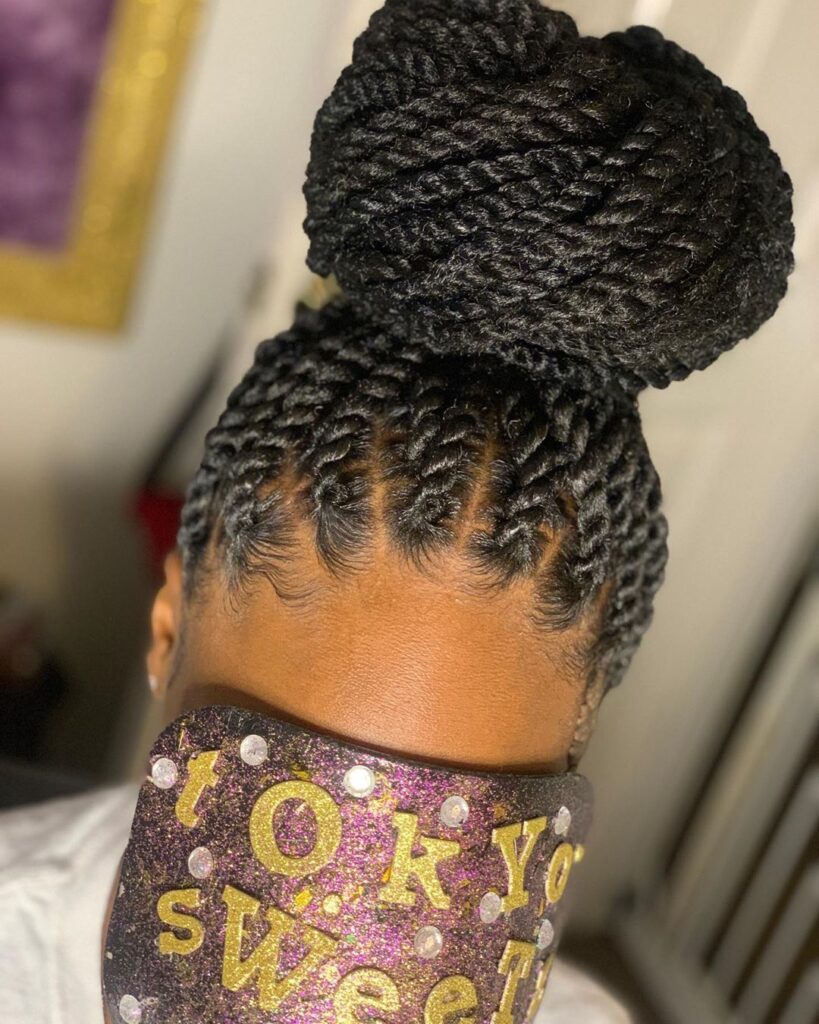 a lady with a twisted updo beautiful afro hairstyle