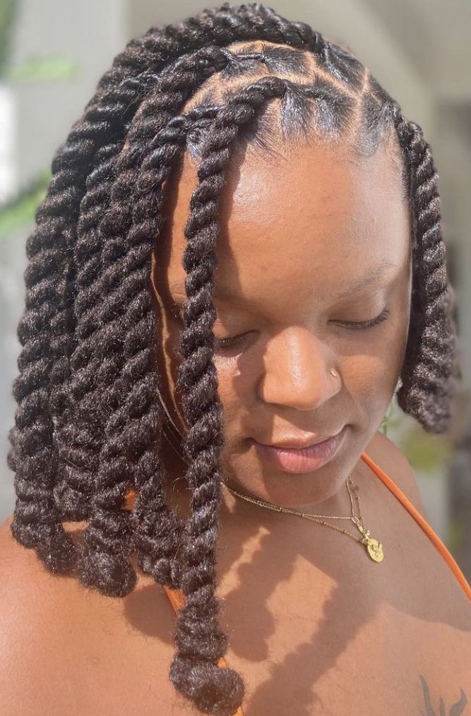 a lady with two strand twist