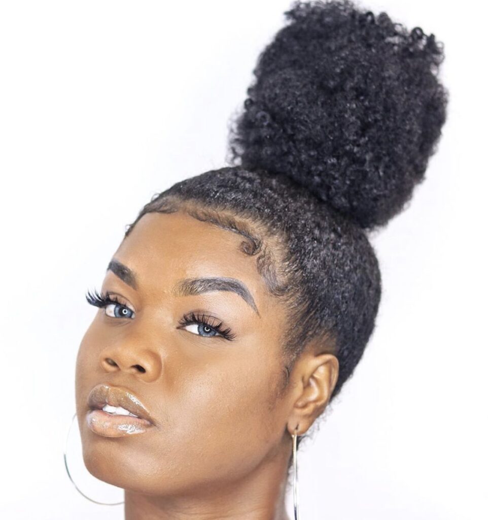 a girl with high bun