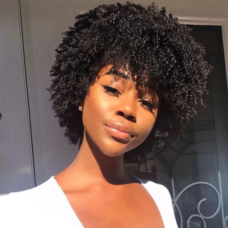 Woman wearing one of the best wash and go hairstyles for natural Afro hair.
