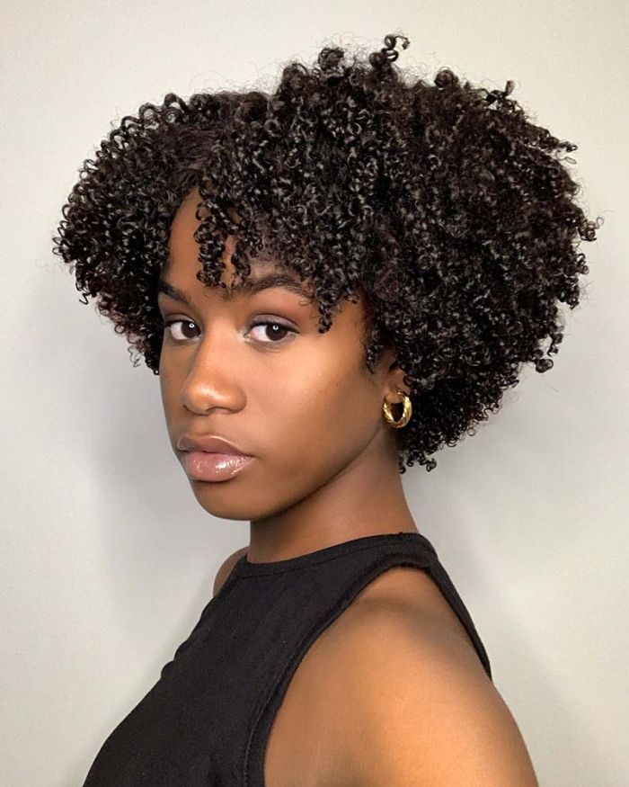 Girl wearing one of the best wash and go hairstyles with a firm gel cast.