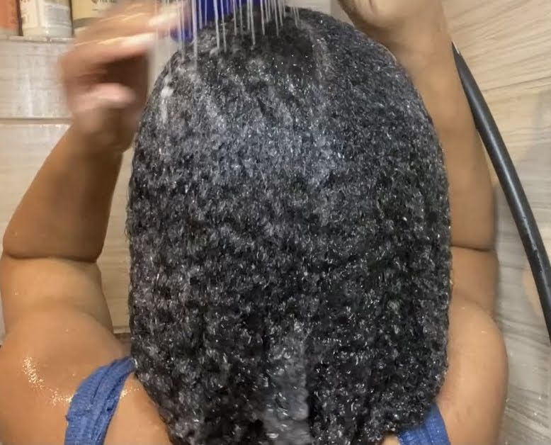 picture of someone washing her hair