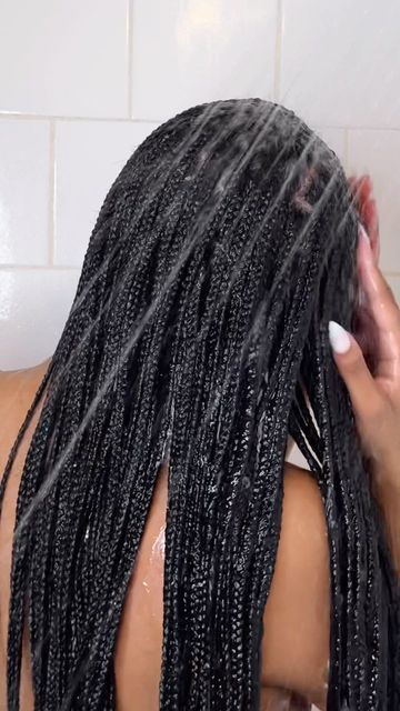 picture of someone wash her braids