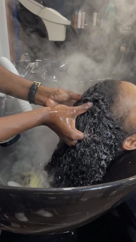 someone washing her hair