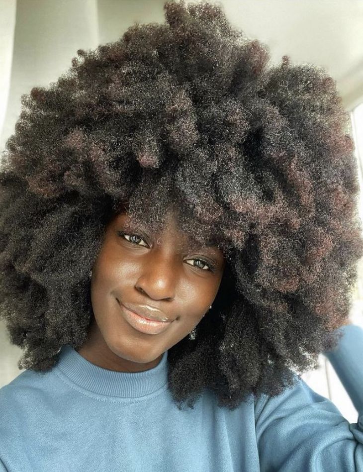 someone with wide afro