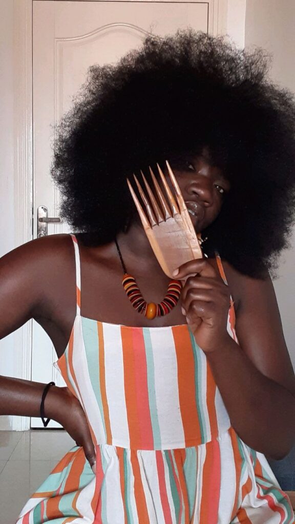 some combing her hair with a wide tooth comb