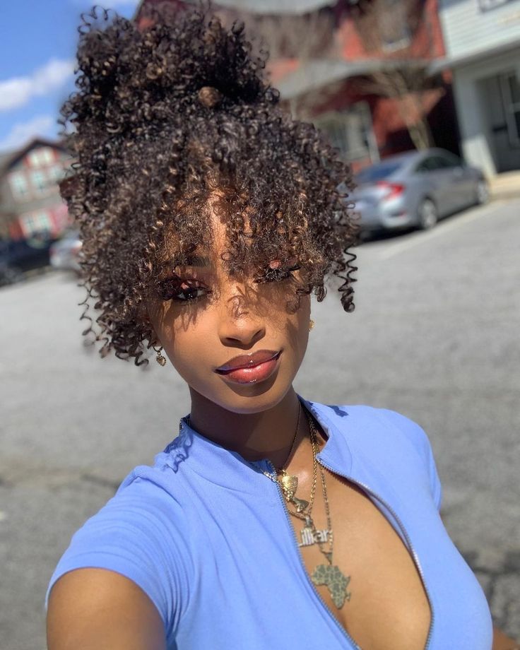 someone with afro puff bangs