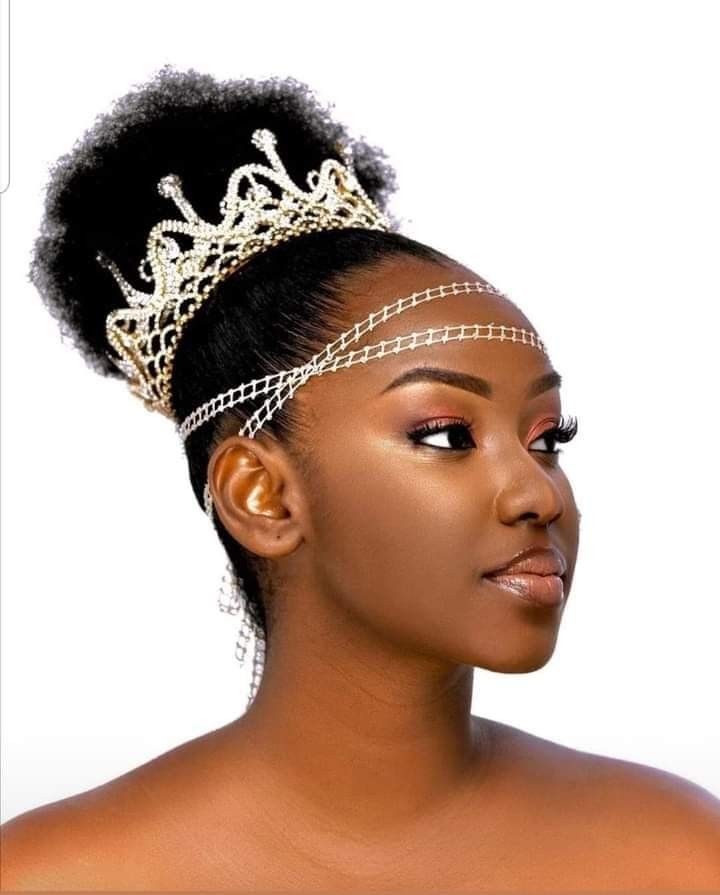 someone with afro puff with chain headpiece