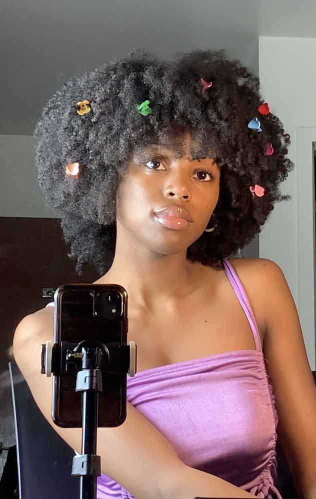 someone with afro with baby hair swirls