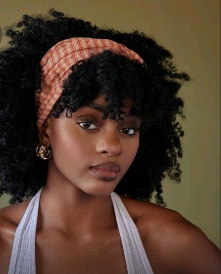 someone with natural hair with bandana