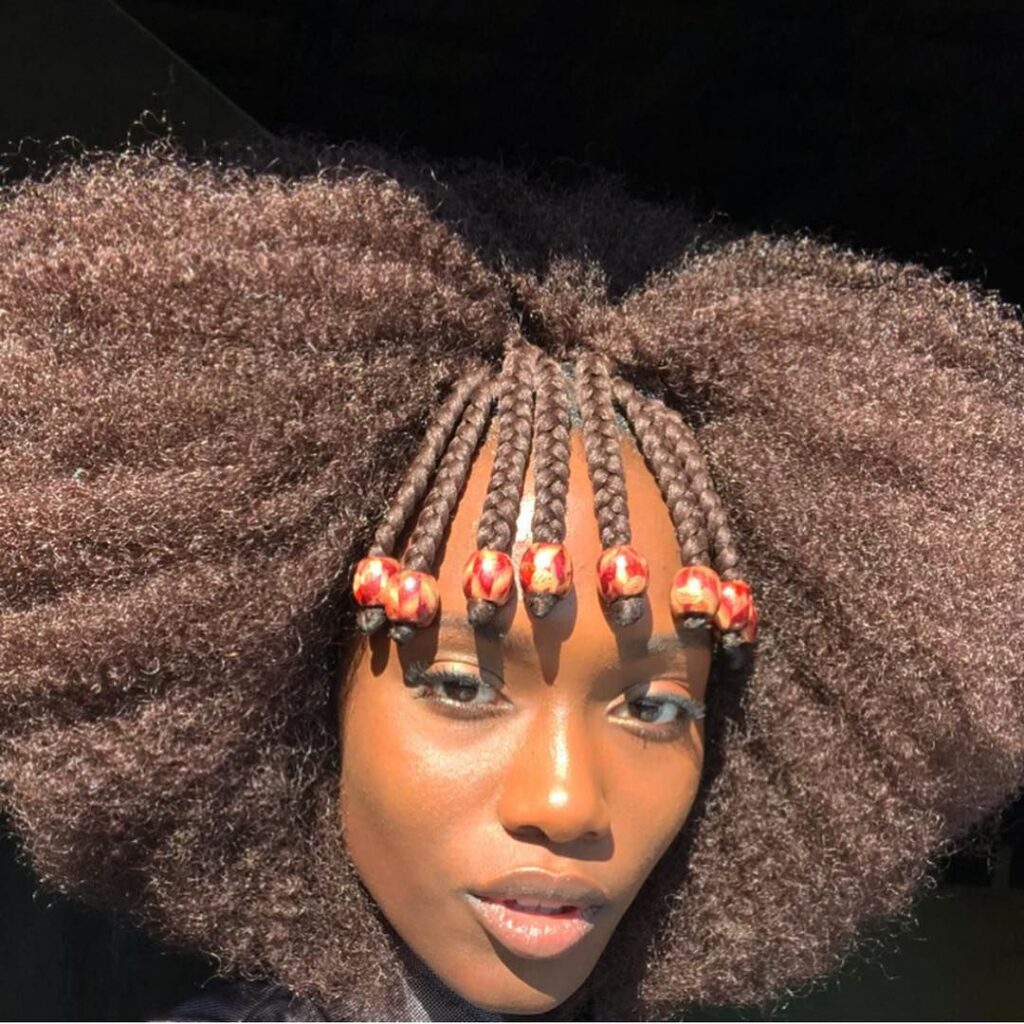 someone with afro with colorful beads afro hairstyle