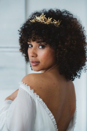 someone with afro with delicate tiara