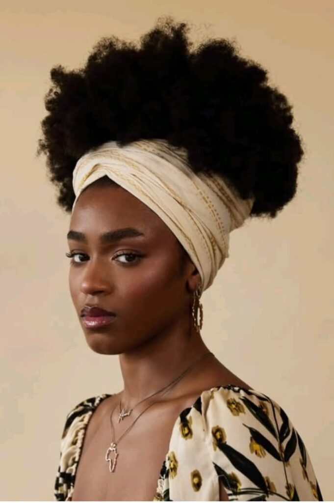 someone with hair with wide headwrap