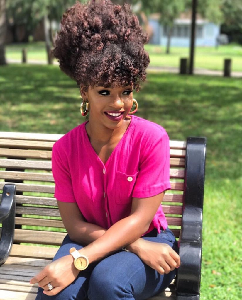 someone with bantu knot out updo