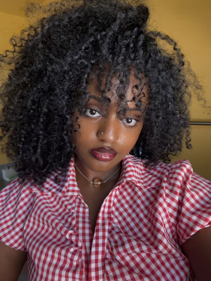 someone with braid out bangs
