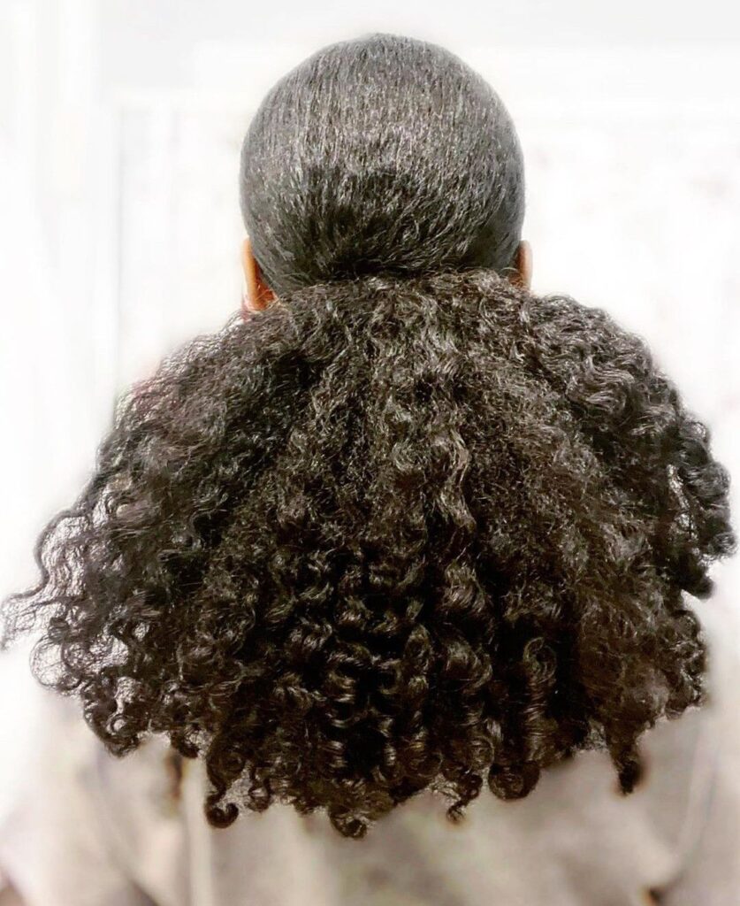 someone with natural hair ponytail