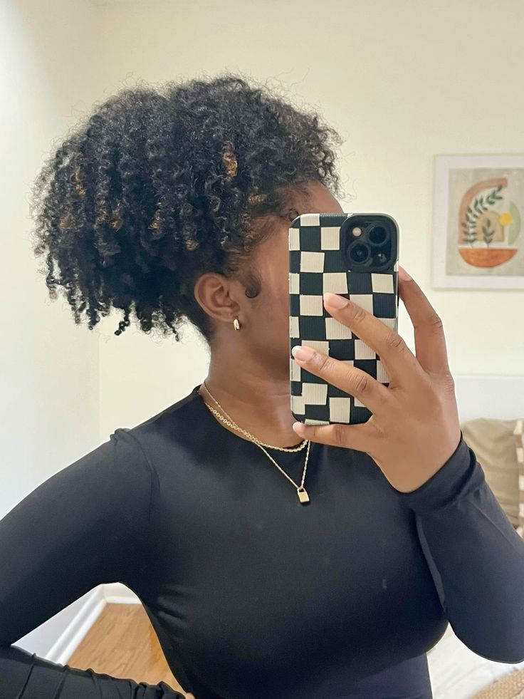 someone with braid out puff