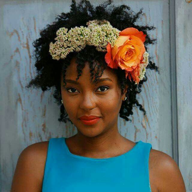 someone with natural hair with flower crown