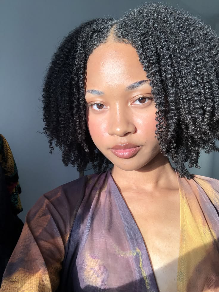 someone with braid out with middle part