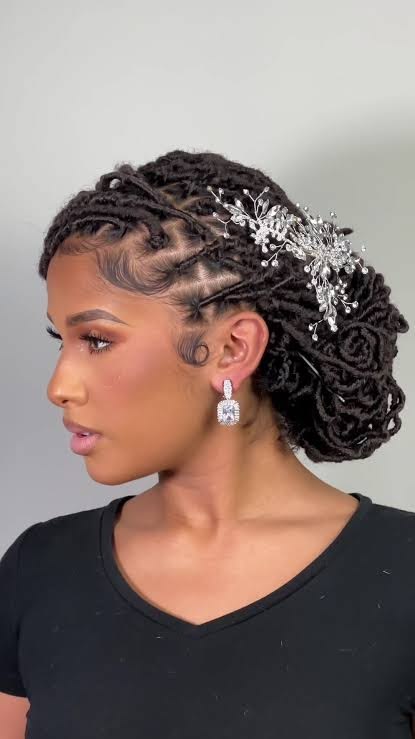 someone with bridal faux locs updo