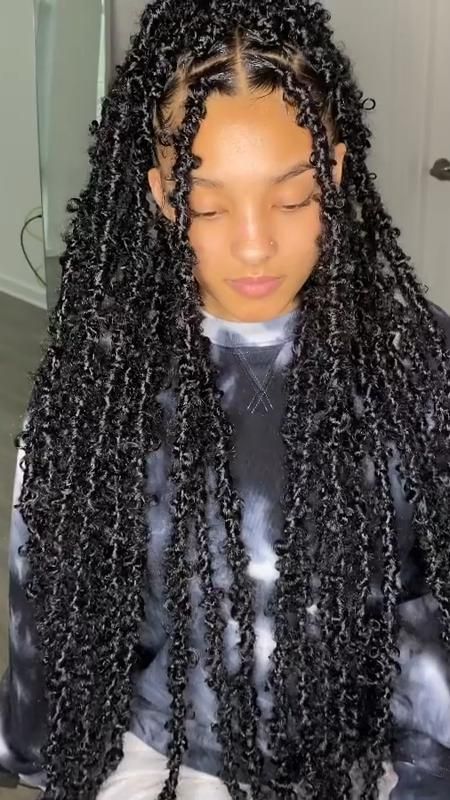 someone with butterfly locs as protective styles for length retention