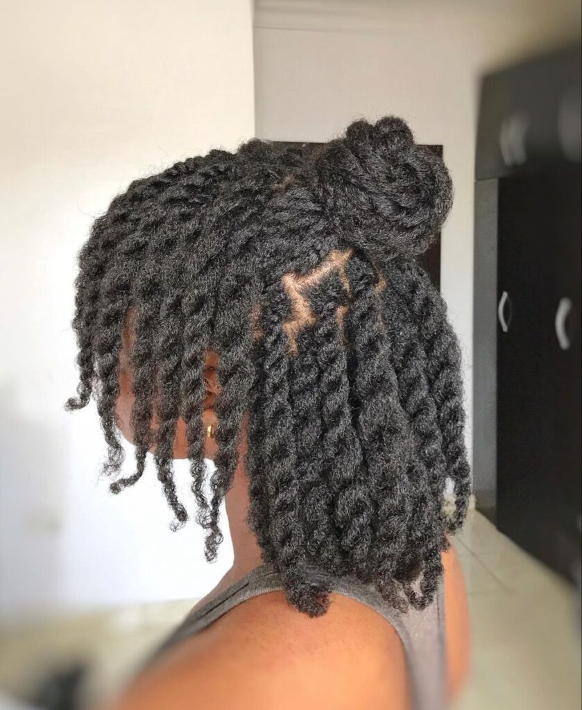 someone with chunky twists as protective styles for length retention