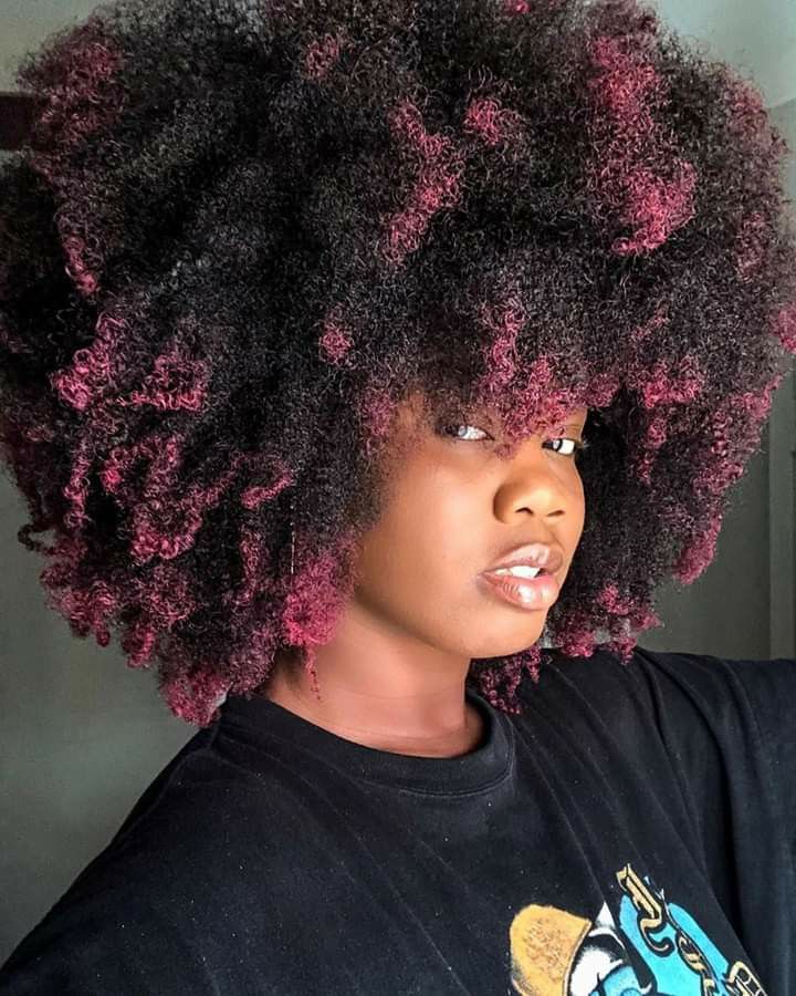 someone with color dipped afro ends hairstyle