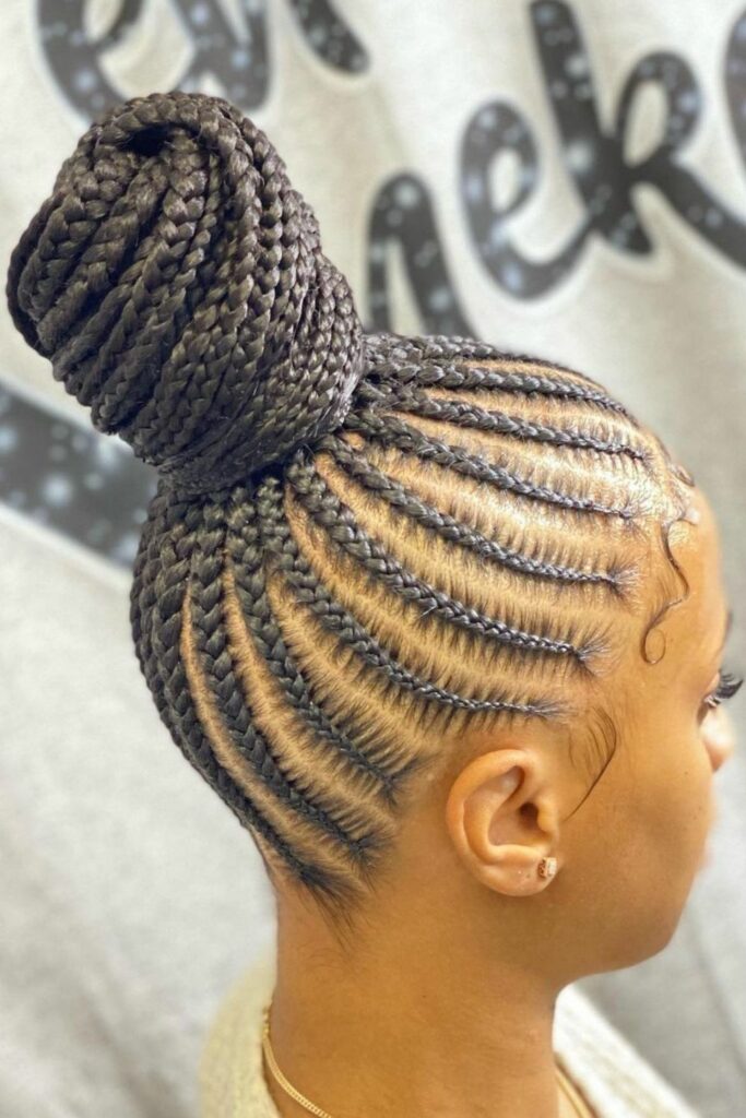 someone with cornrows updo
