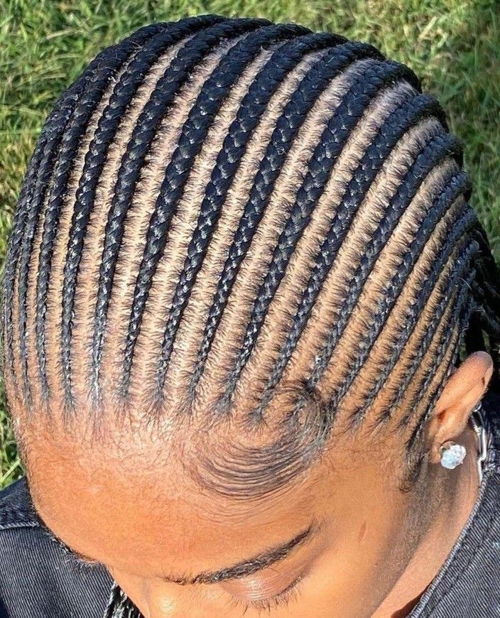 someone with cornrows straight back