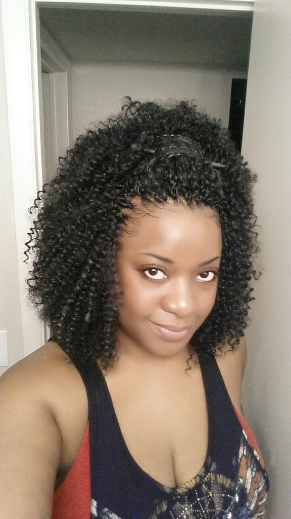 someone with crochet braids pull back