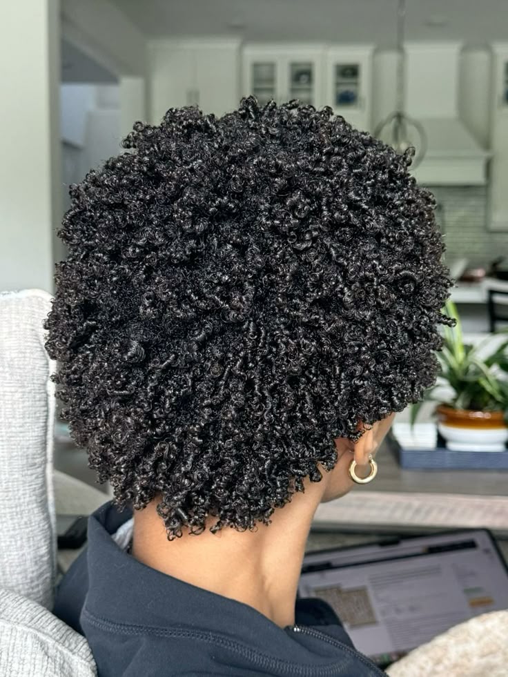 someone  curly defined afro hairstyle