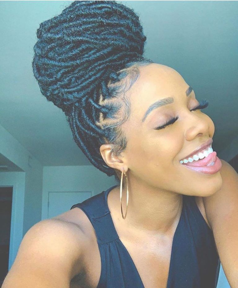 someone with faux locs in a bun