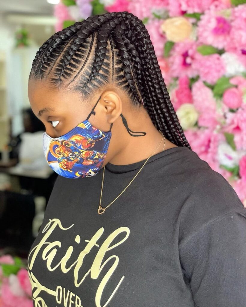 someone with feed in braids